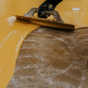 A contractor applying coating