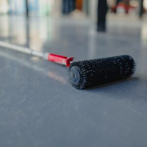 A floor maintenance brush