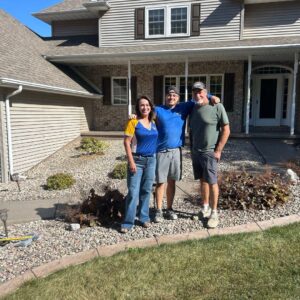 Happy customers with a team member