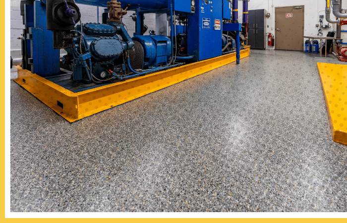 Industrial Polyurea floor coating with safety yellow curb | Chemical-resistant flooring for mechanical and generator rooms