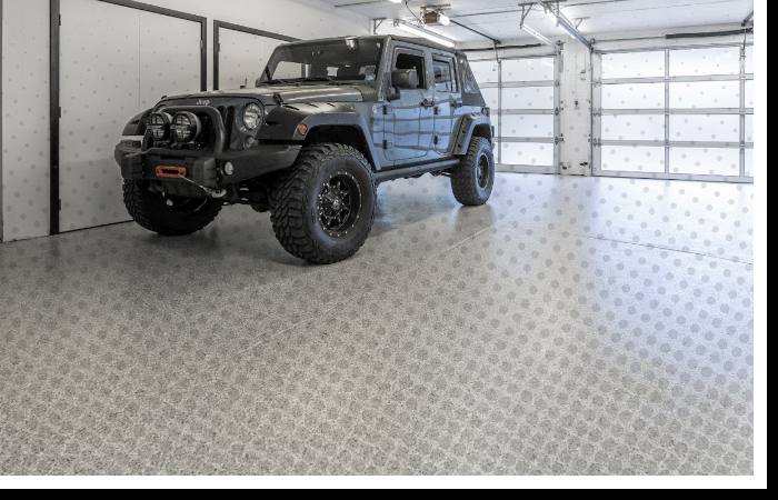 Slip-resistant patterned Polyurea coating in residential garage with SUV | Tough vehicle-ready floor system