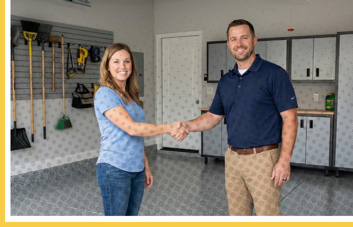 A BAM Coatings contractor shaking hands with a happy customer on a newly installed garage floor.