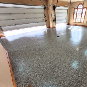 Sunlight hitting a UV-stable concrete floor coating in a bright, open garage.