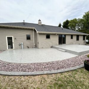 Close-up of a realistic stone-textured concrete overlay for an outdoor patio.