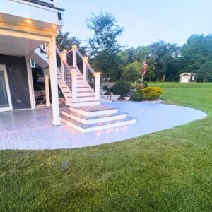 A low-maintenance, stain-resistant decorative concrete floor in an outdoor dining space.