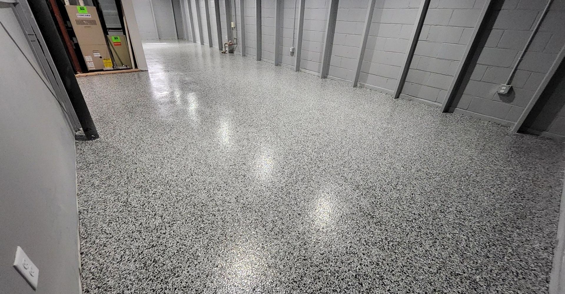 large room with concrete overlay flooring