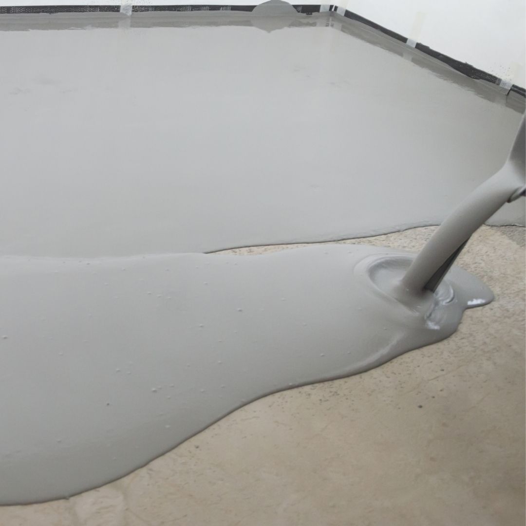 a coating being poured on concrete